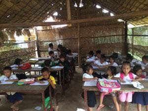 Picture of children sitting at tables.