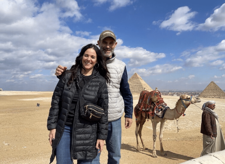 Dan and Debbie Smith pose beside a camel.